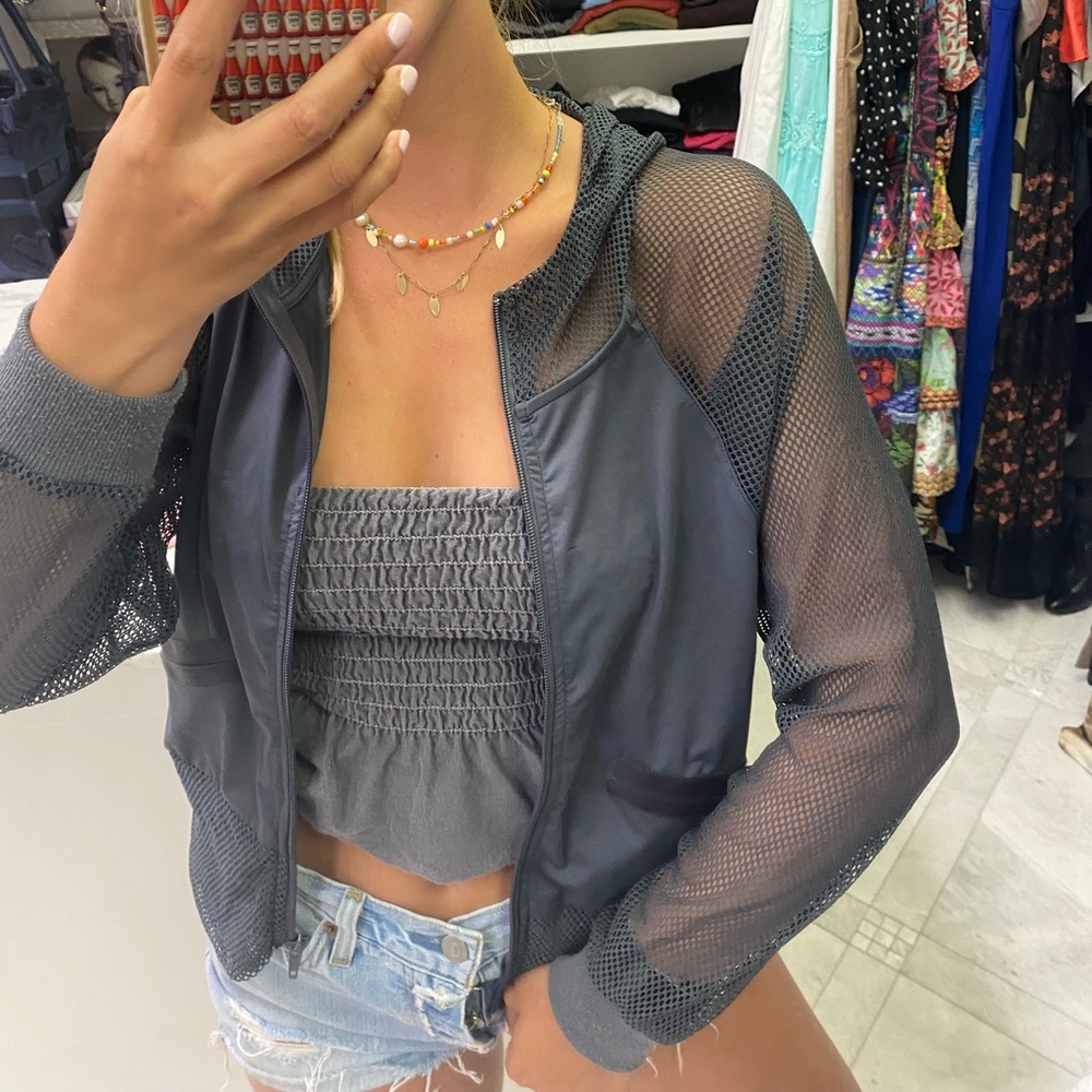 Gray light jacket with mesh sleeves and hood